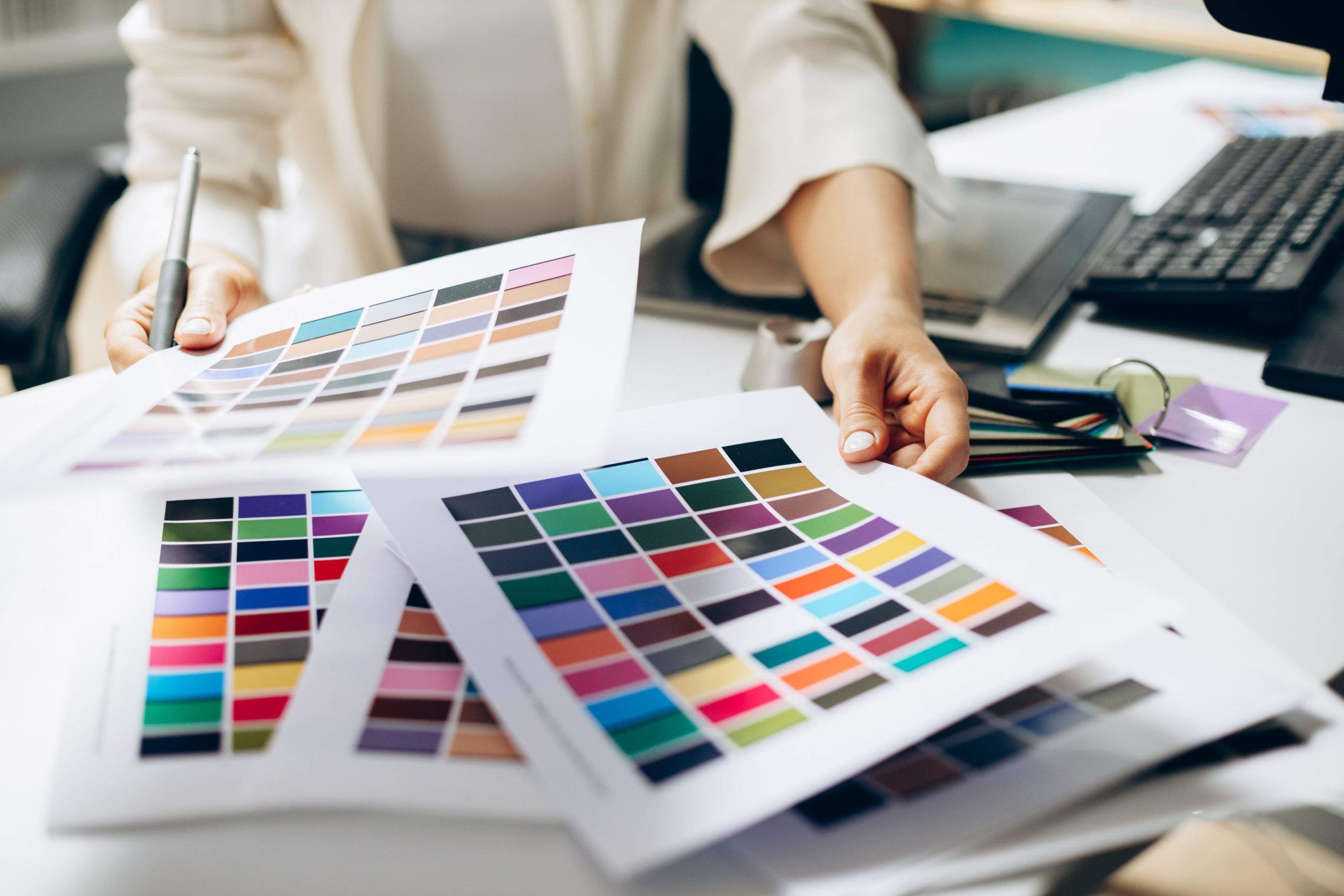 Female,Digital,Designer,Looking,At,Swatches,At,An,Office